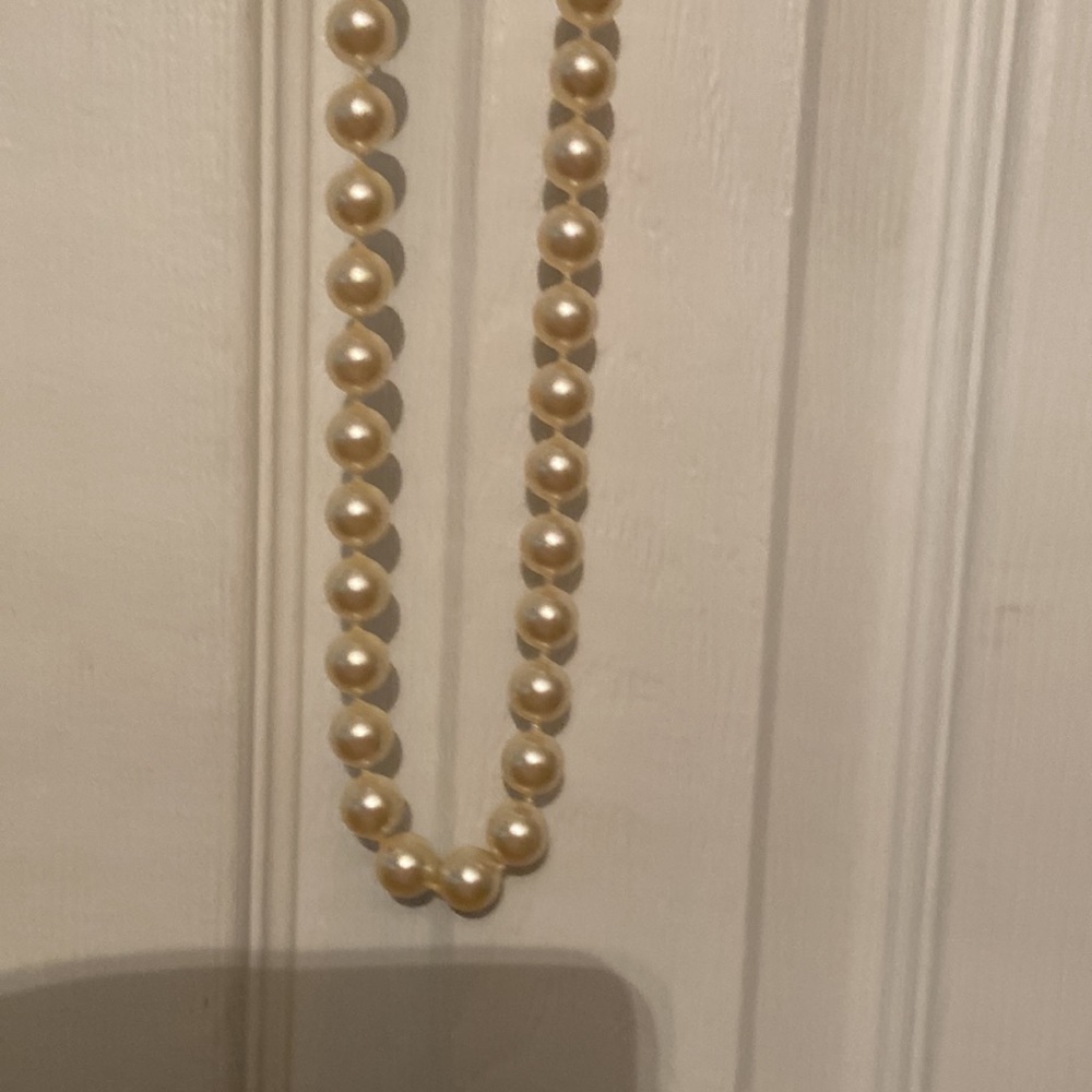 Beautiful large faux pearl necklace.